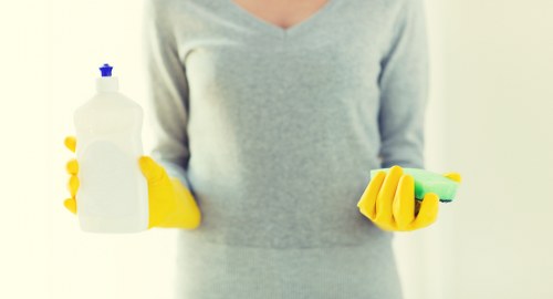 Careful inspection and cleaning of a wool rug in North West London