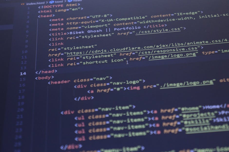 A photograph of a computer screen displaying HTML code, with syntax highlighting in various colors such as blue, pink, and red. The code includes tags like <!DOCTYPE html>, <html>, <hea